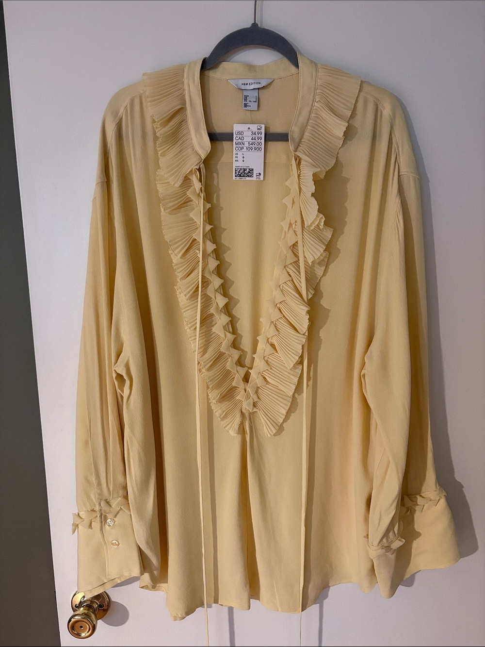 H&M Pale Yellow Ruffle V-Neck Blouse, size large. New with tags.
